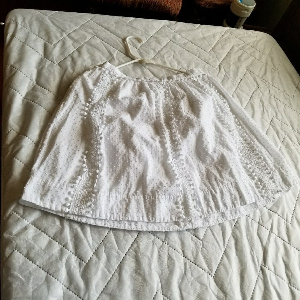 A white skirt with flowy patters